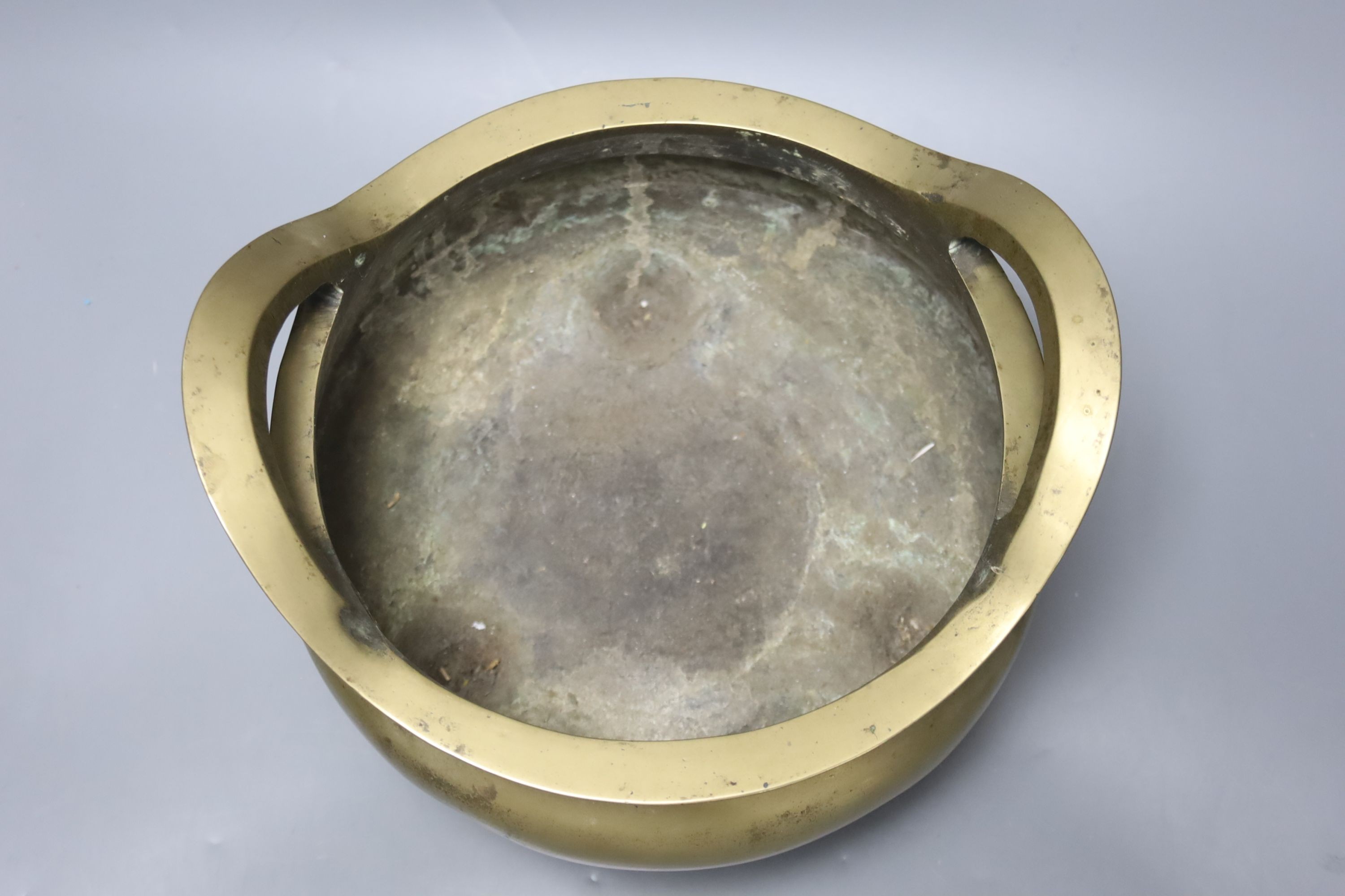 A large Chinese bronze tripod censer Xuande mark, early 20th century, 25cm wide